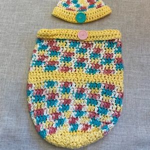 Crocheted baby hat with matching cocoon.